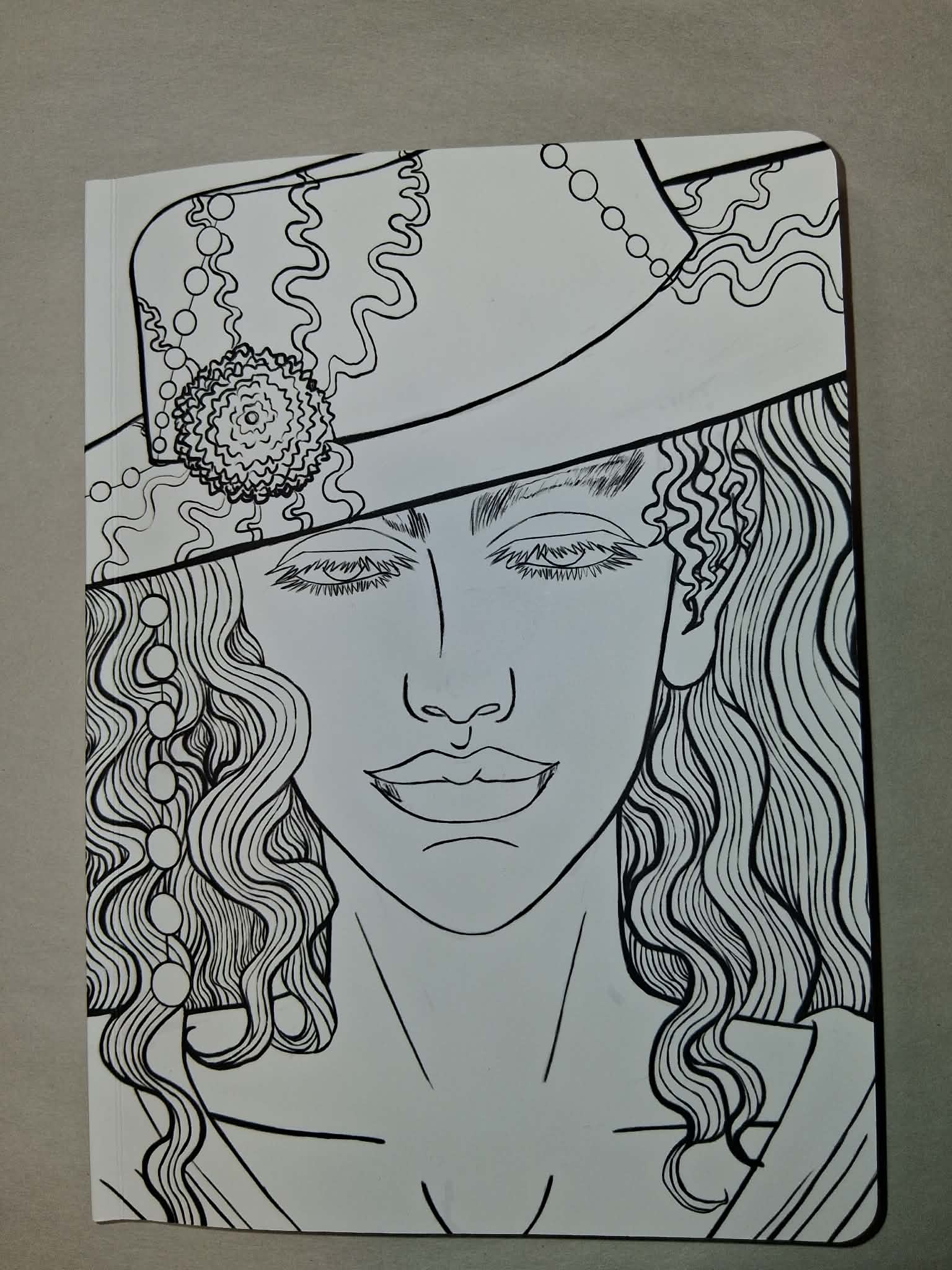 Black and white line drawing of a woman's face with intricate details on a plain background