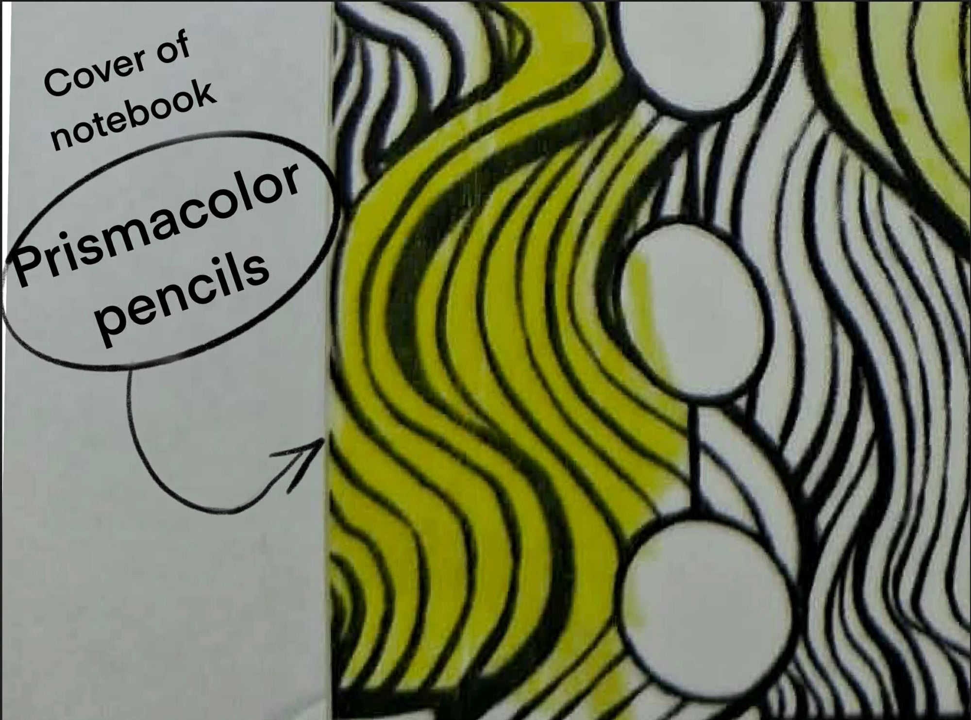 Notebook cover with wavy line design and text indicating Prismacolor pencils
